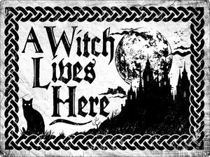A witch lives here Xlarge tin sign